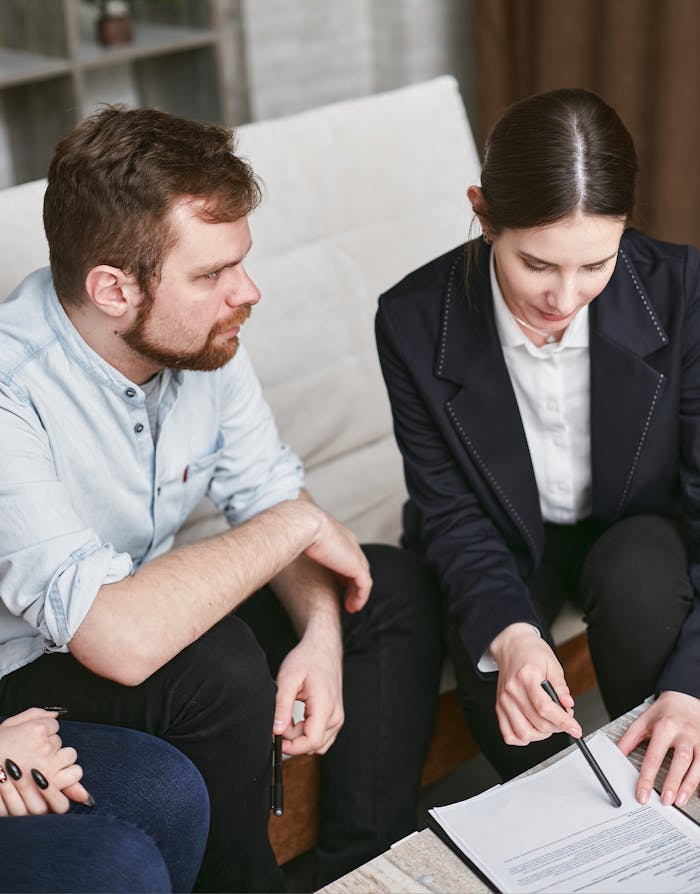 Business professionals in a meeting reviewing significant documents in an office setting.